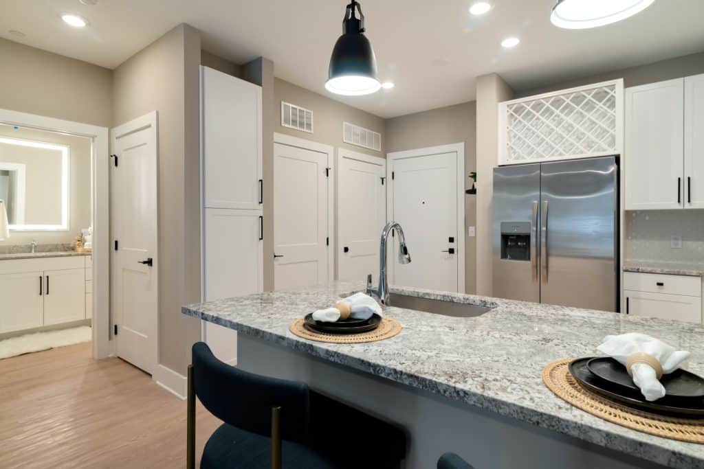 Ample lighting inside modern apartment kitchens at Margaux Midtown