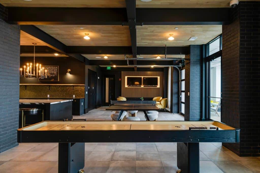 Shuffleboard table in community clubroom at Margaux Midtown