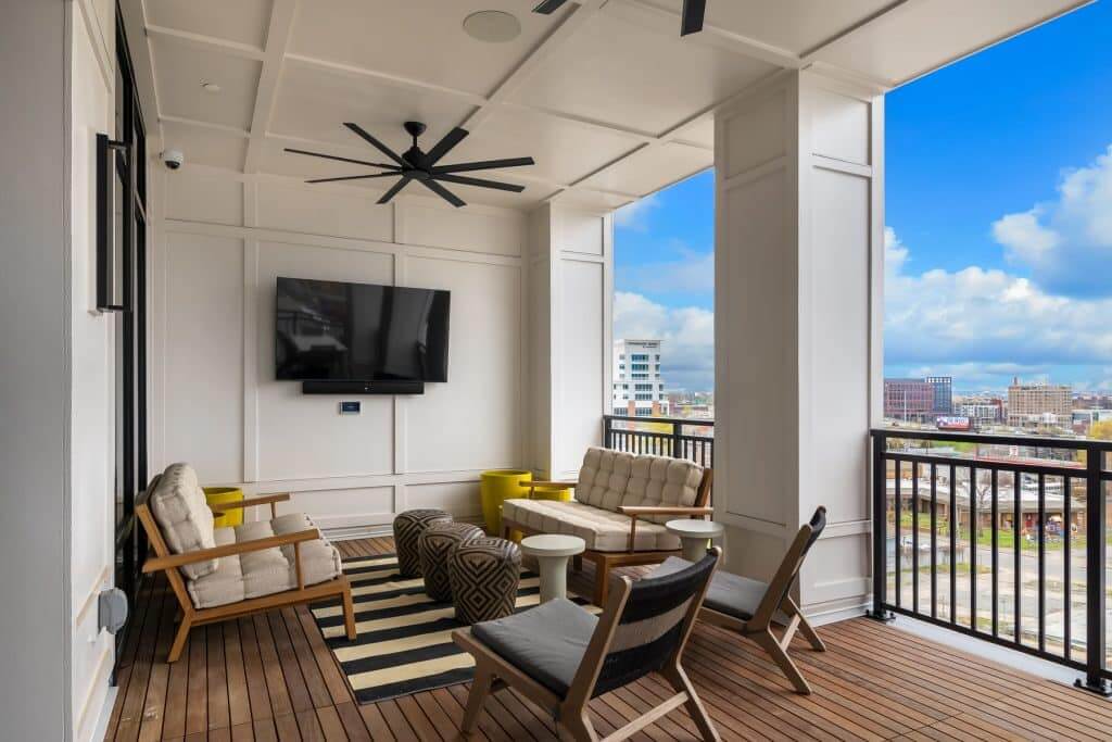 Outdoor TV and seating on community balcony at Margaux Midtown