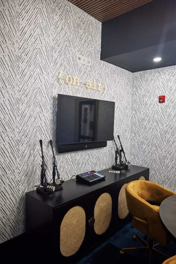 Fully equipped podcast room with a TV open to residents at Margaux Midtown