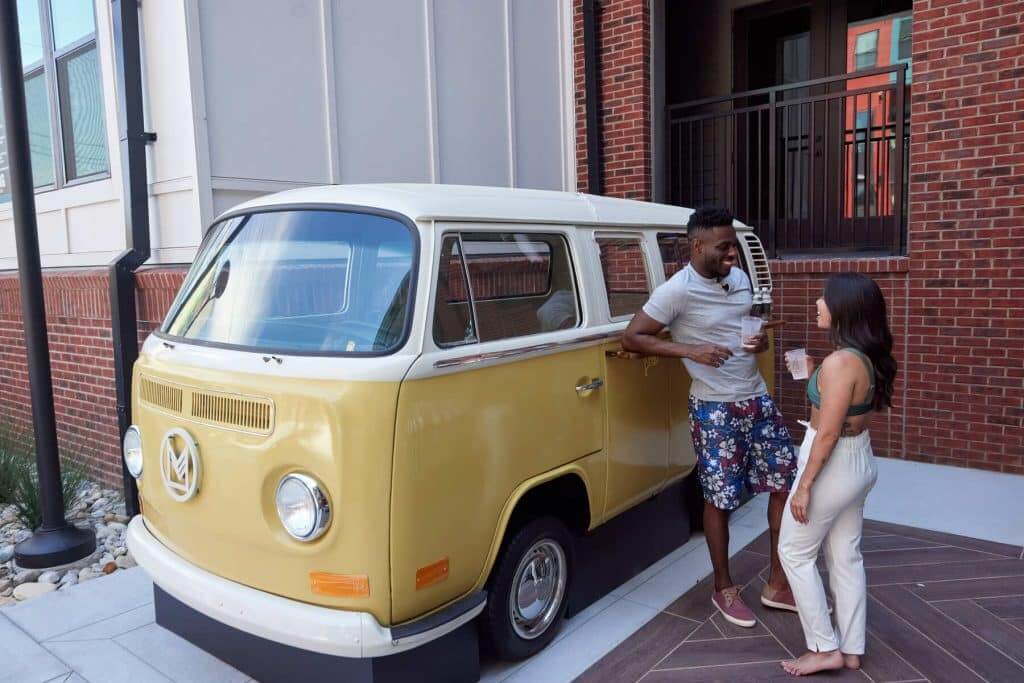 Margaux Midtown residents standing in front of van in courtyard