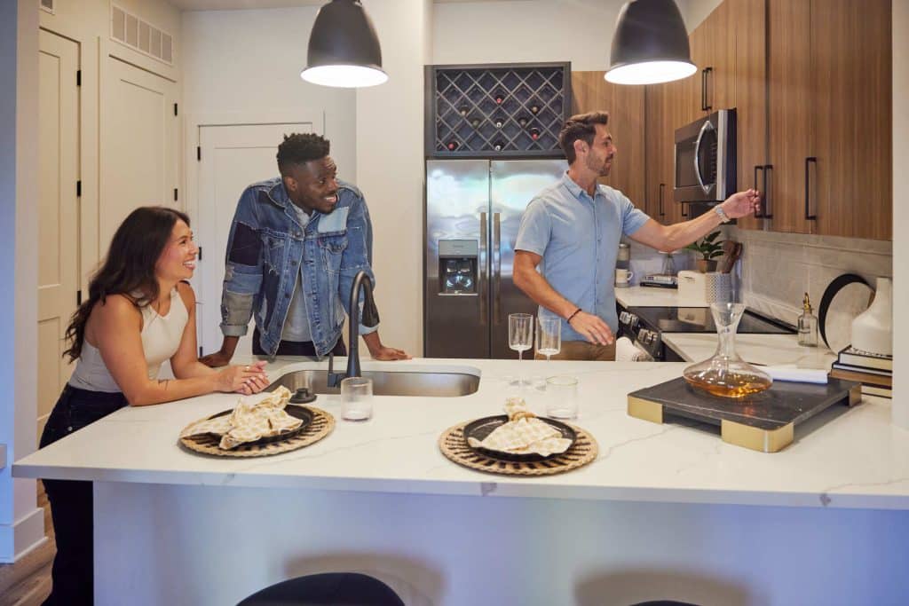 Margaux Midtown residents cooking in an apartment kitchen